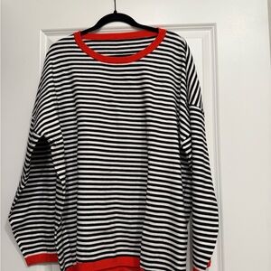 Striped Black and White Sweater with Orange Accents